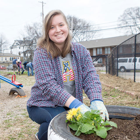 student working at food bank