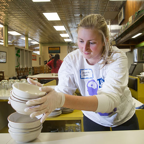 student working at food bank