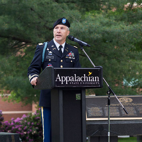 officer giving speech on memorial day