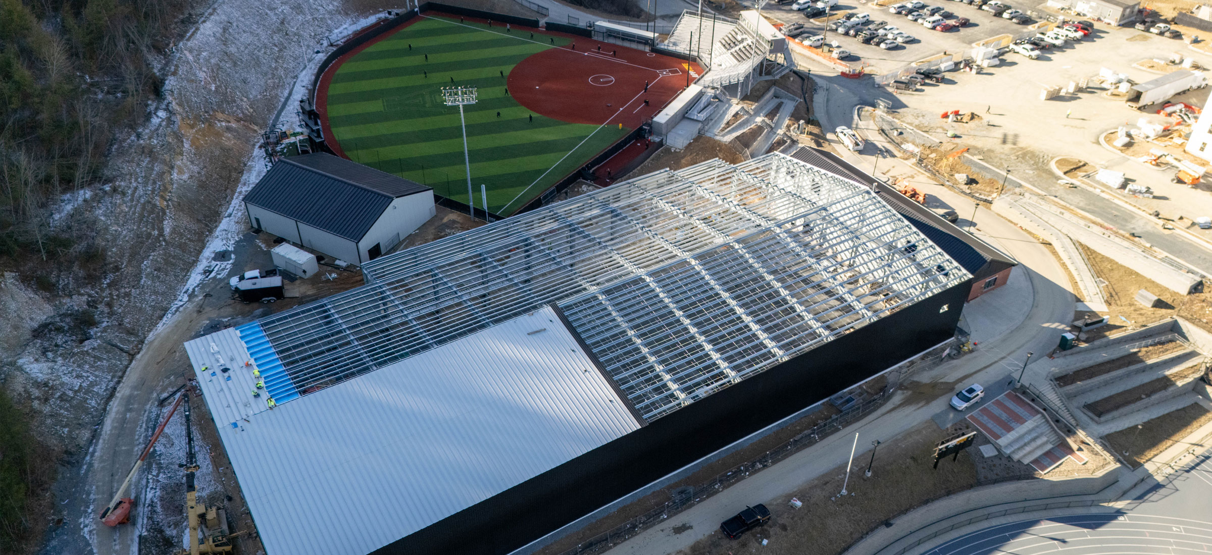 Workers have begun applying the roofing system for the indoor tennis facility at App State's Appalachian 105 Sports Complex.