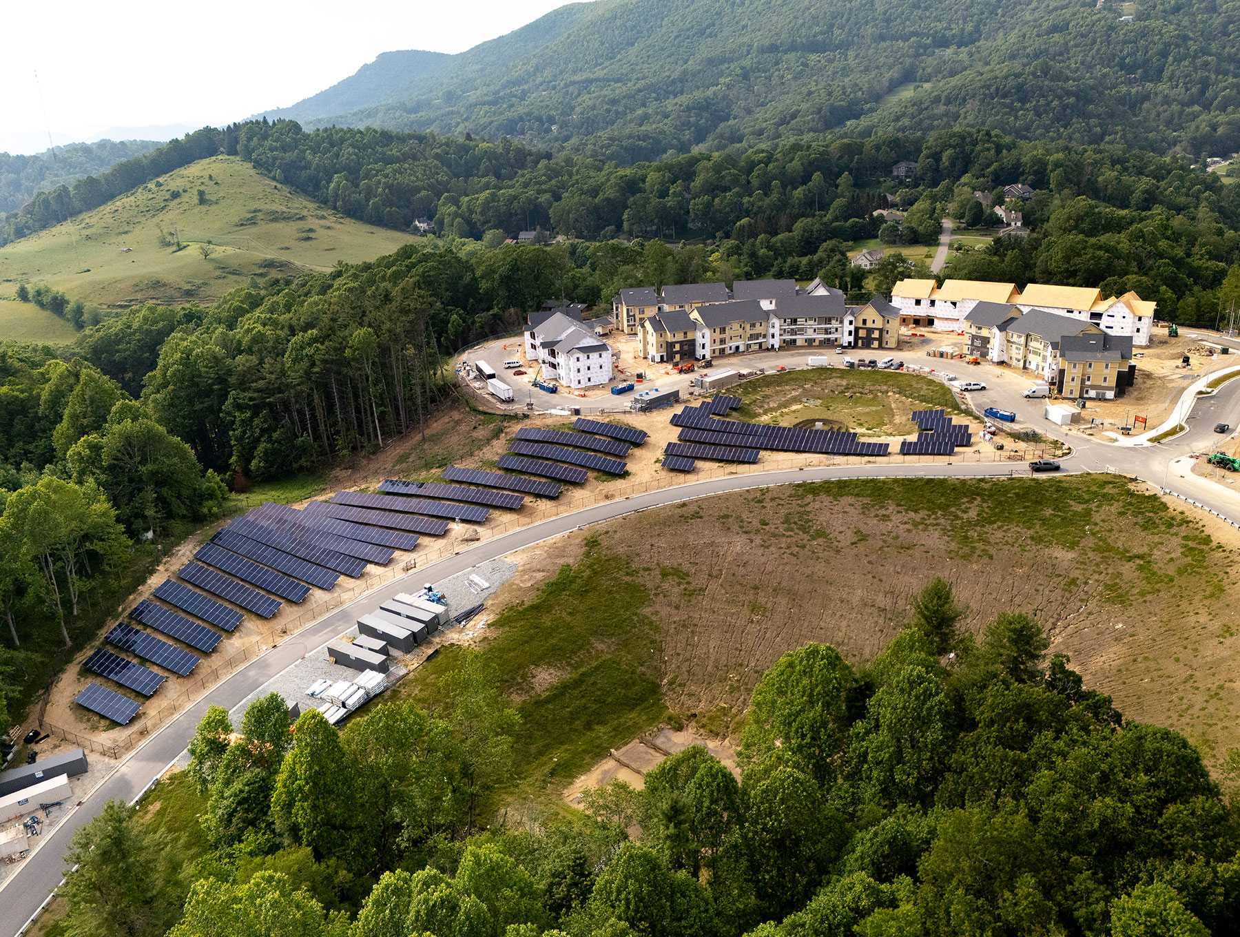Aerial photo shows housing under construction and solar panels at App State, June 2025.