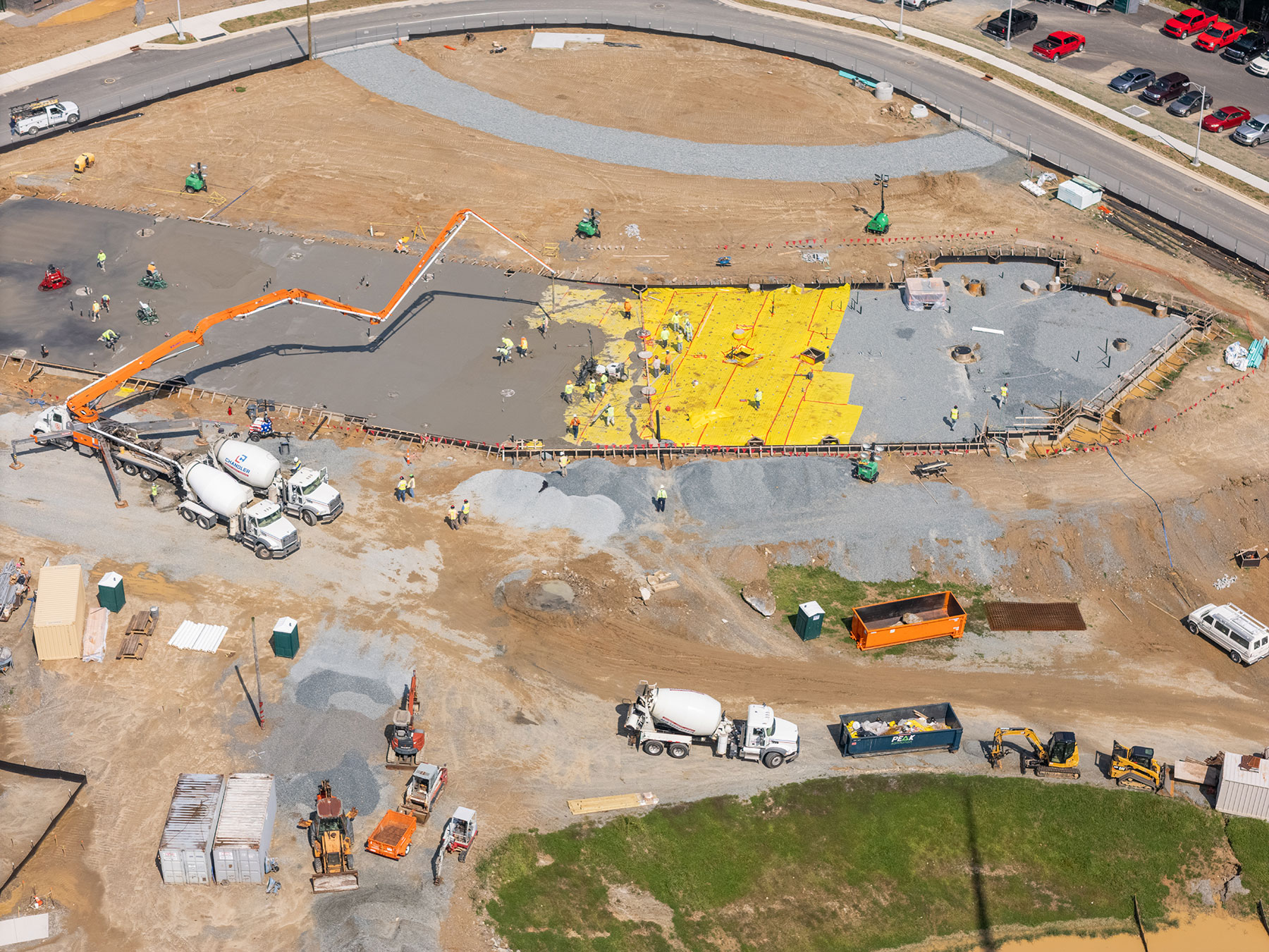 Aerial view of STEM Academic Building construction at App State, showing poured slab and utilities work.