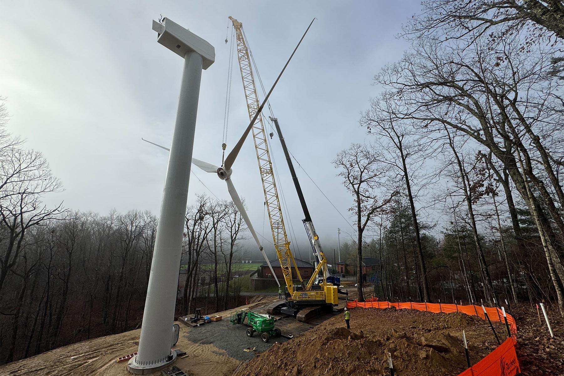 Workers assemble one of two new wind turbines at App State’s Innovation District