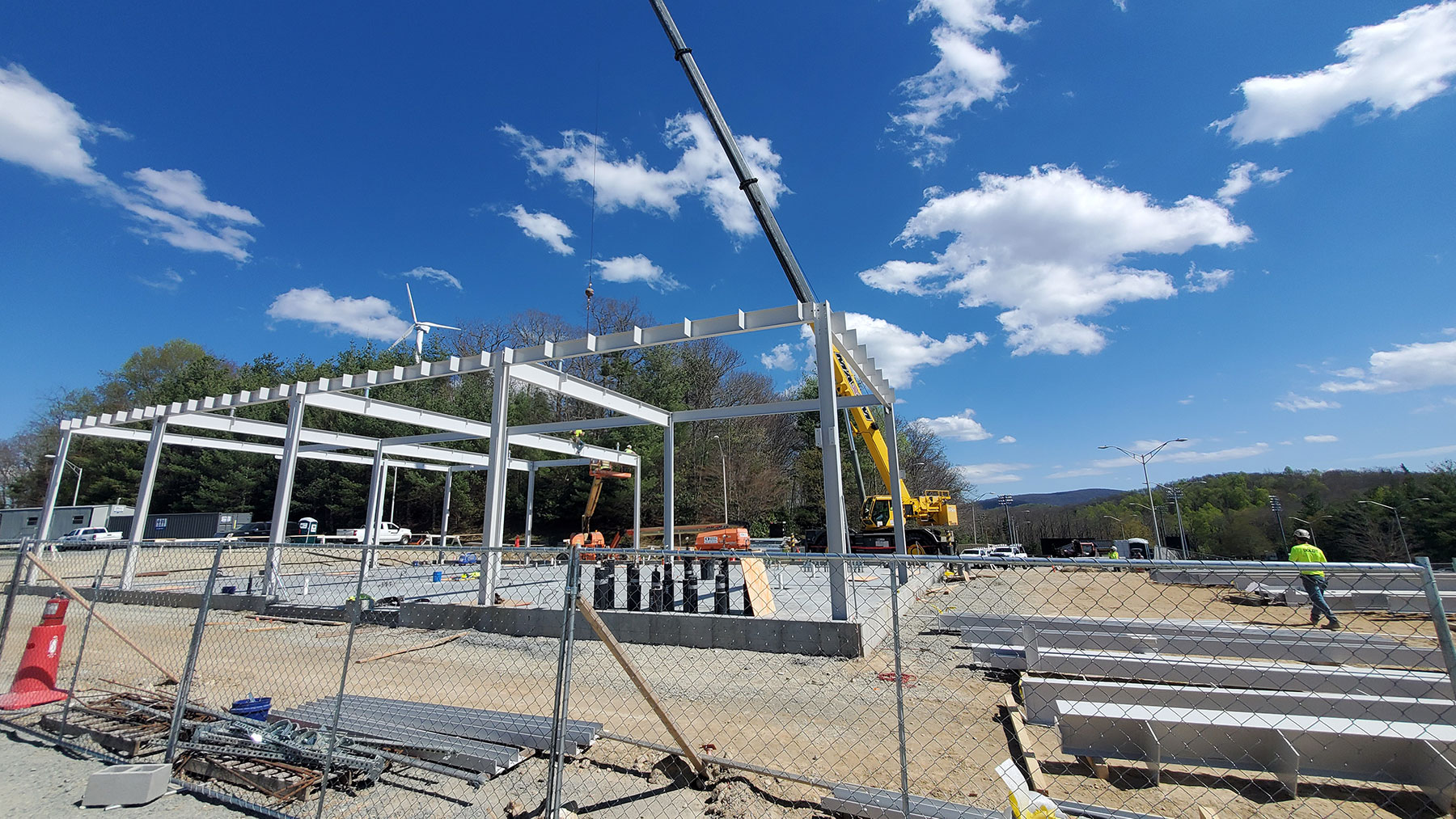Workers are shown installing framing for the energy system control building at App State’s Innovation District