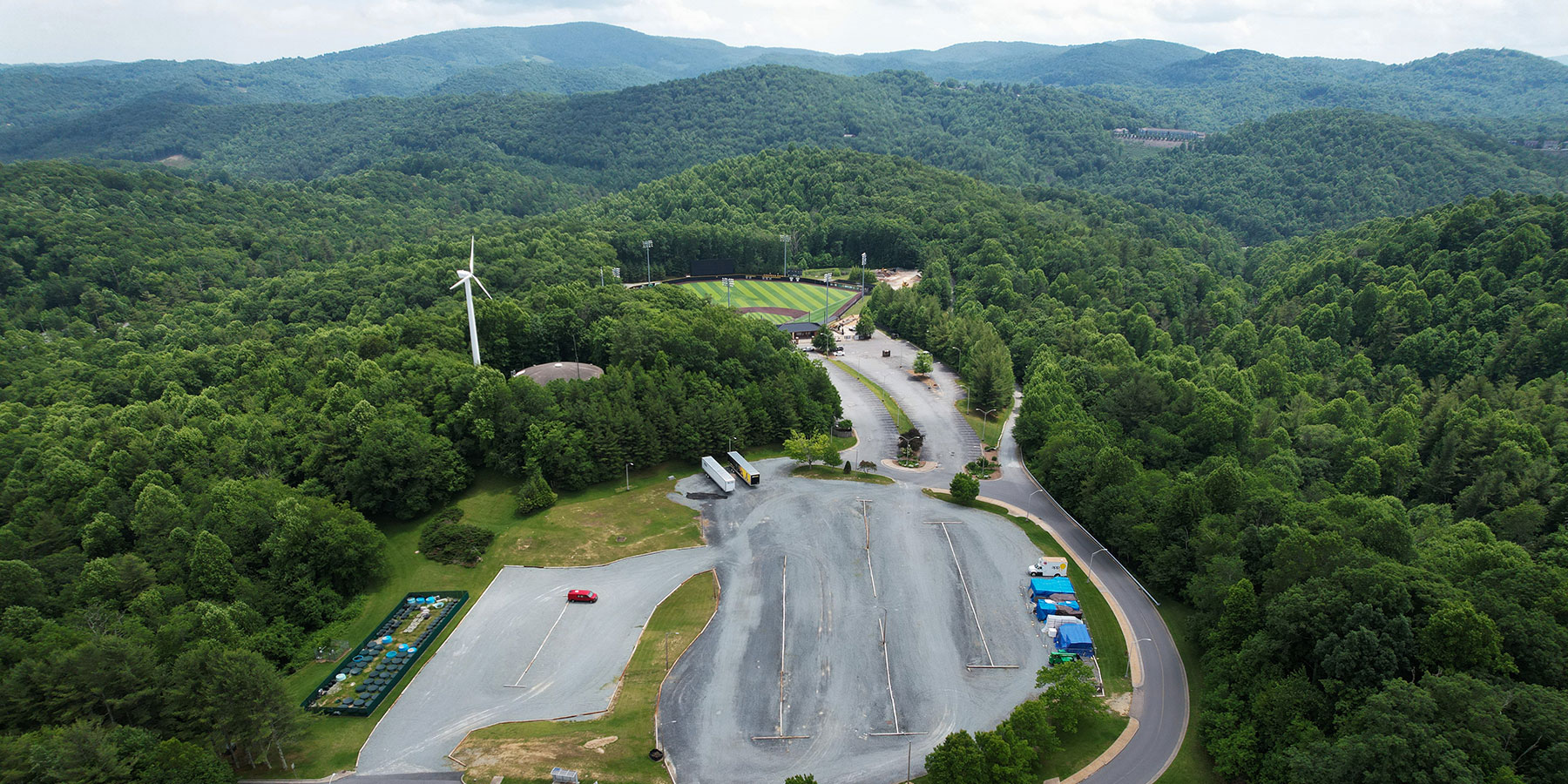 This aerial photo, taken June 13, 2022, shows the future home of App State’s Innovation District project. The site is located atop Bodenheimer Drive. Click on the image for a full view. Photo by Wes Craig and Chase Reynolds 