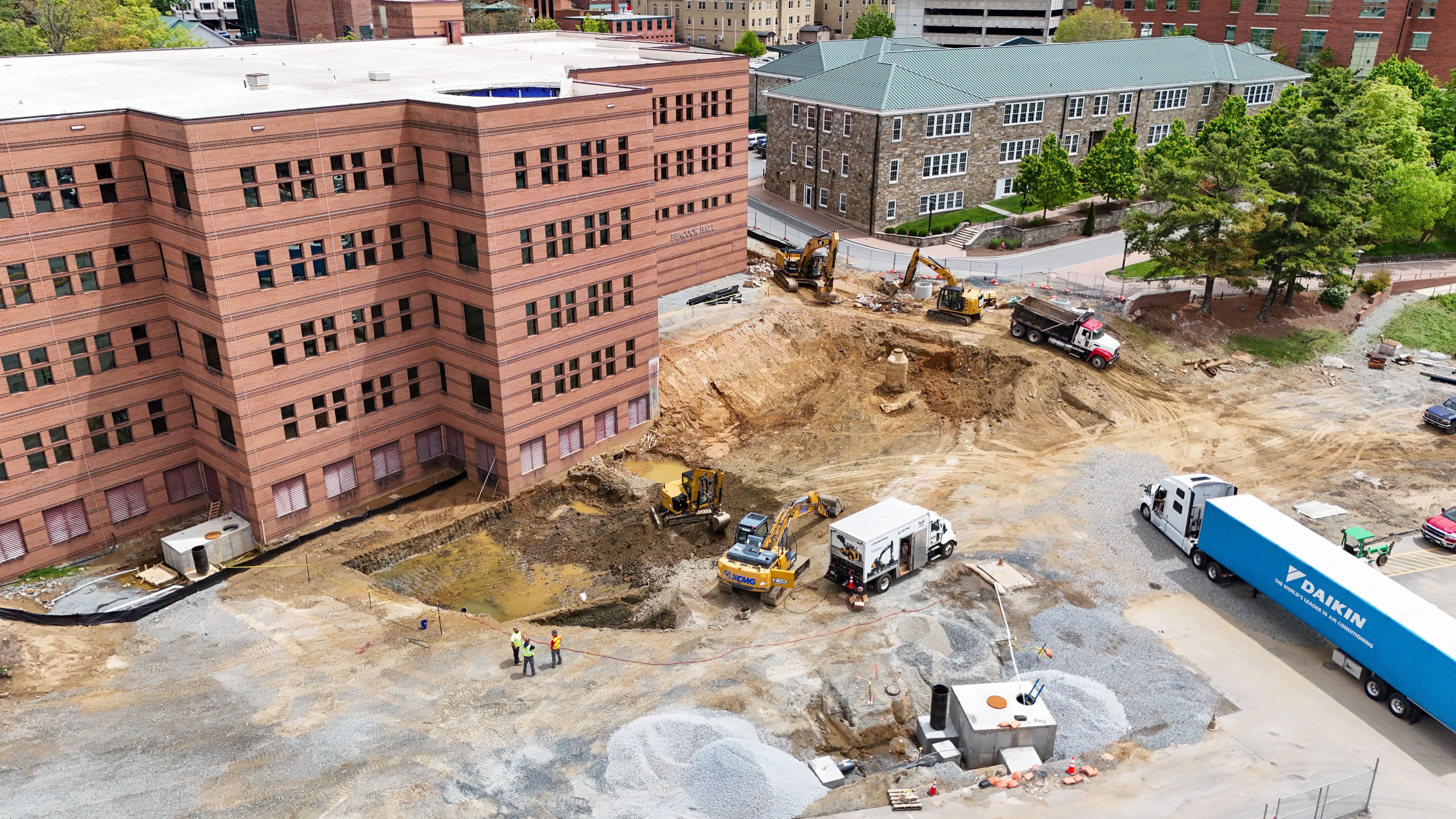 May 7, 2025 aerial photo shows utility work wrapping up for App State’s Peacock Hall addition, with foundation installation set for June.