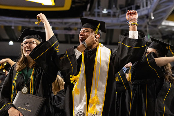 two graduates during App State’s Spring 2024 Commencement